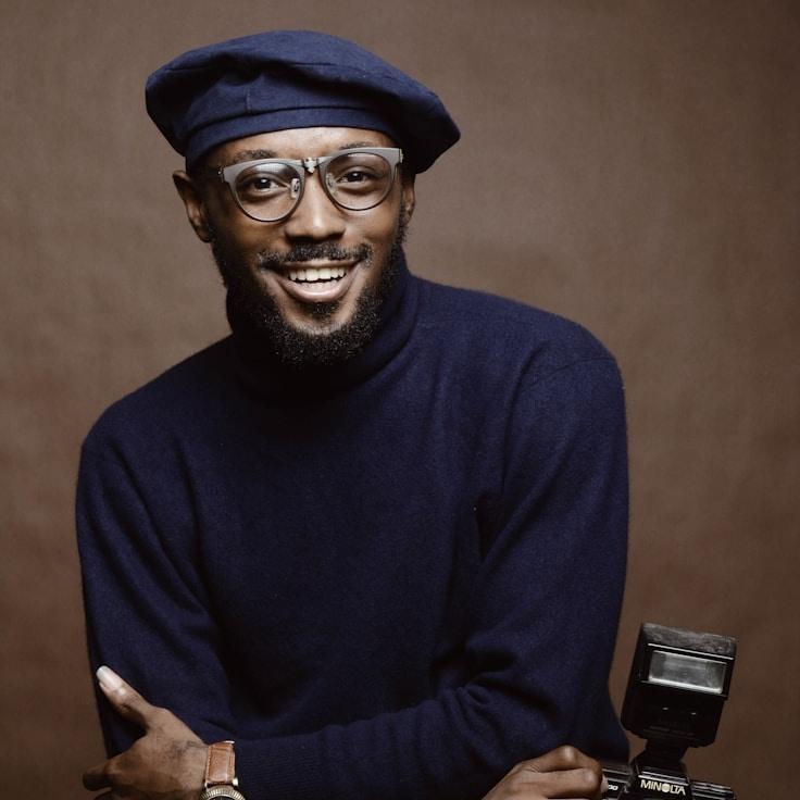 J. Reed, Client Relations Director, discussing corporate gifting strategy with business clients